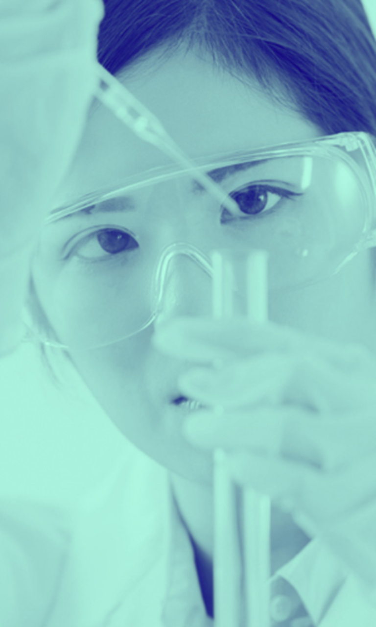 scientist looking into test tube